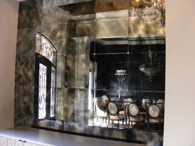 A wall with a picture of a dining room in it