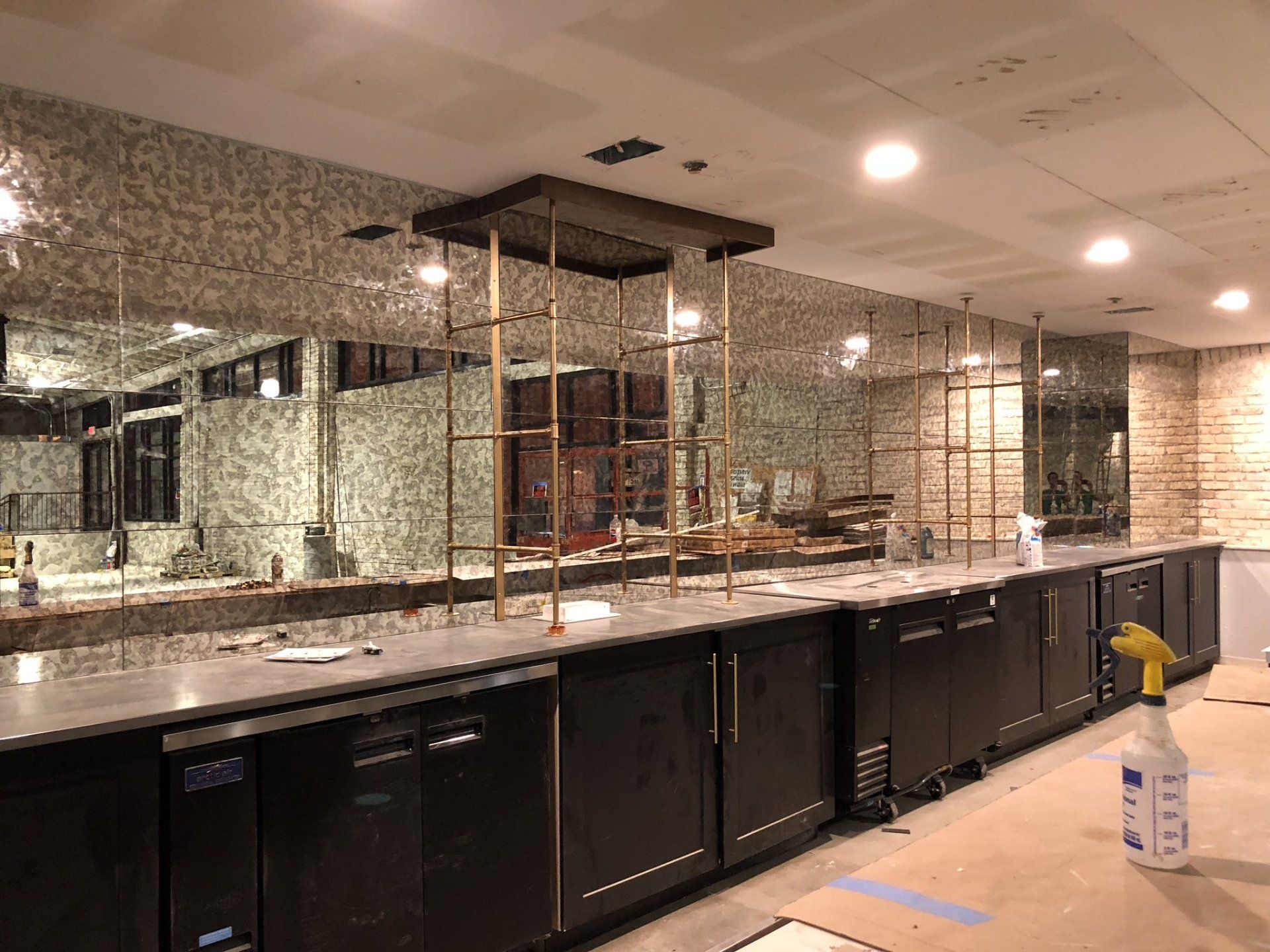 A large room with a lot of cabinets and mirrors.