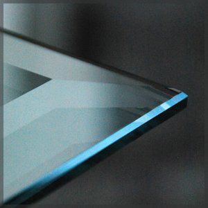 A close up of a piece of glass with a blue edge