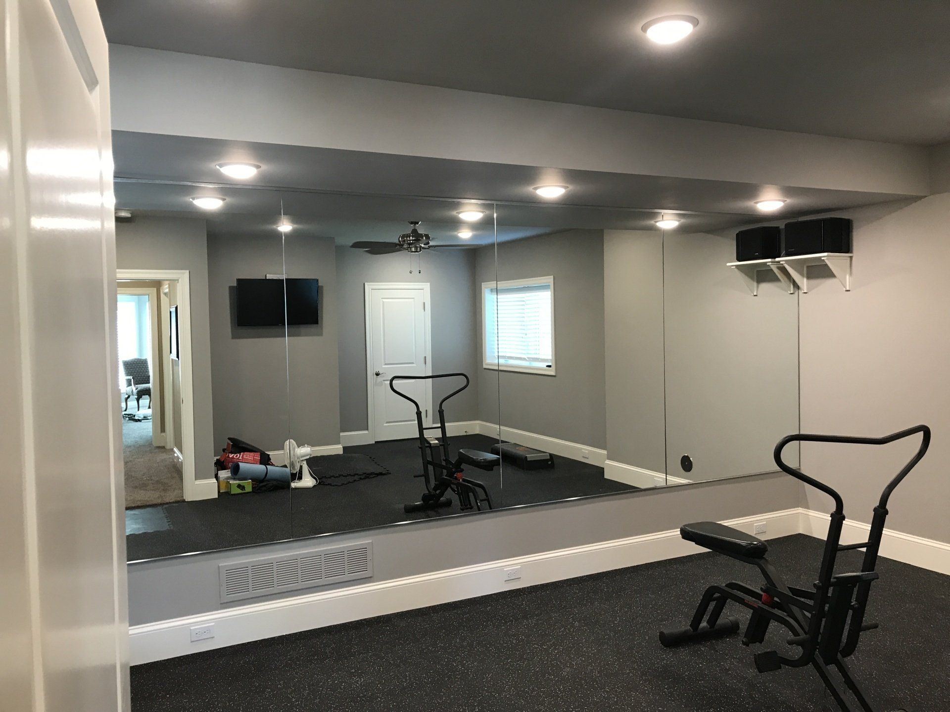 There is a large mirror in the middle of the room.