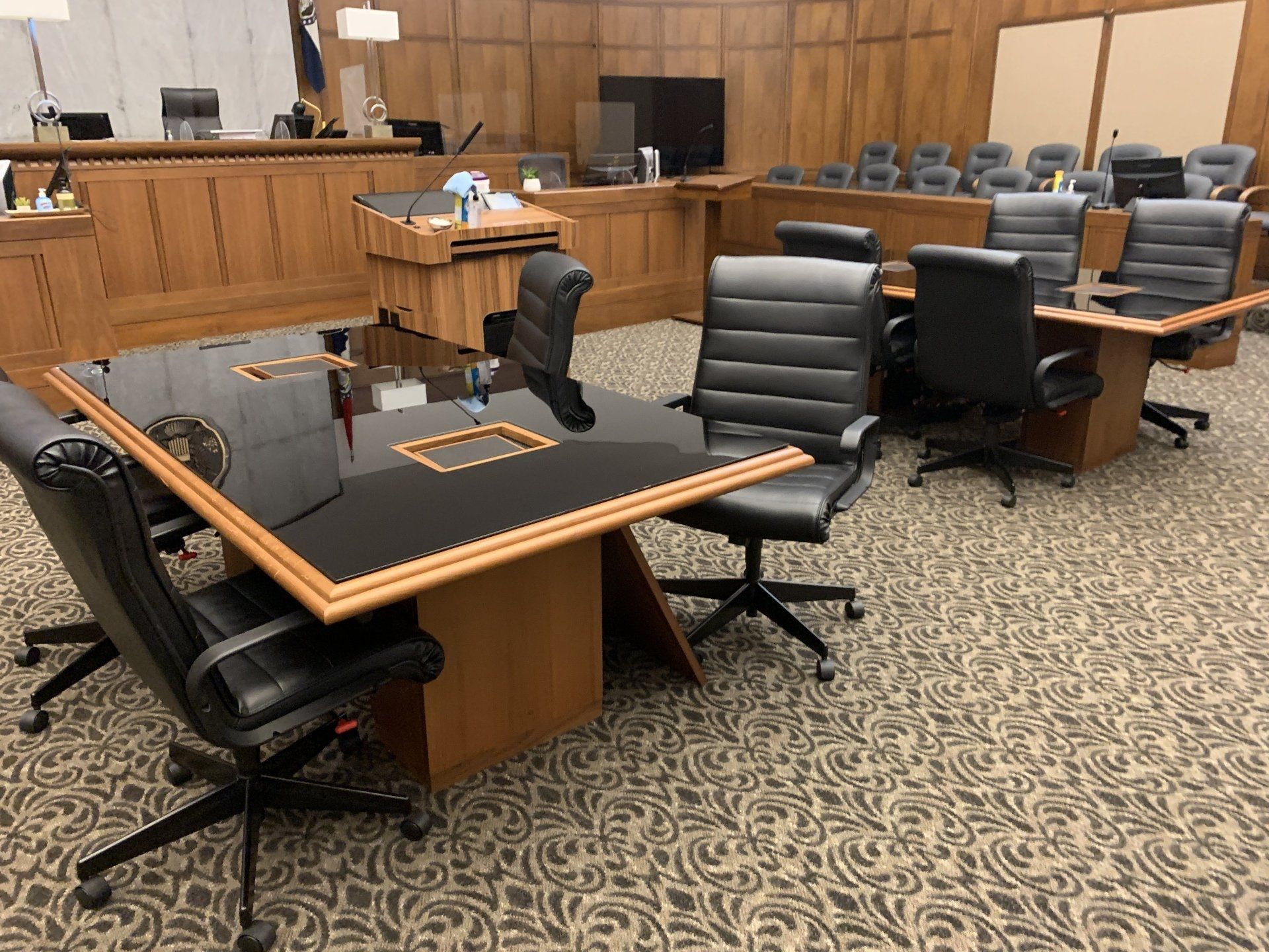 A conference room with a table and chairs in it