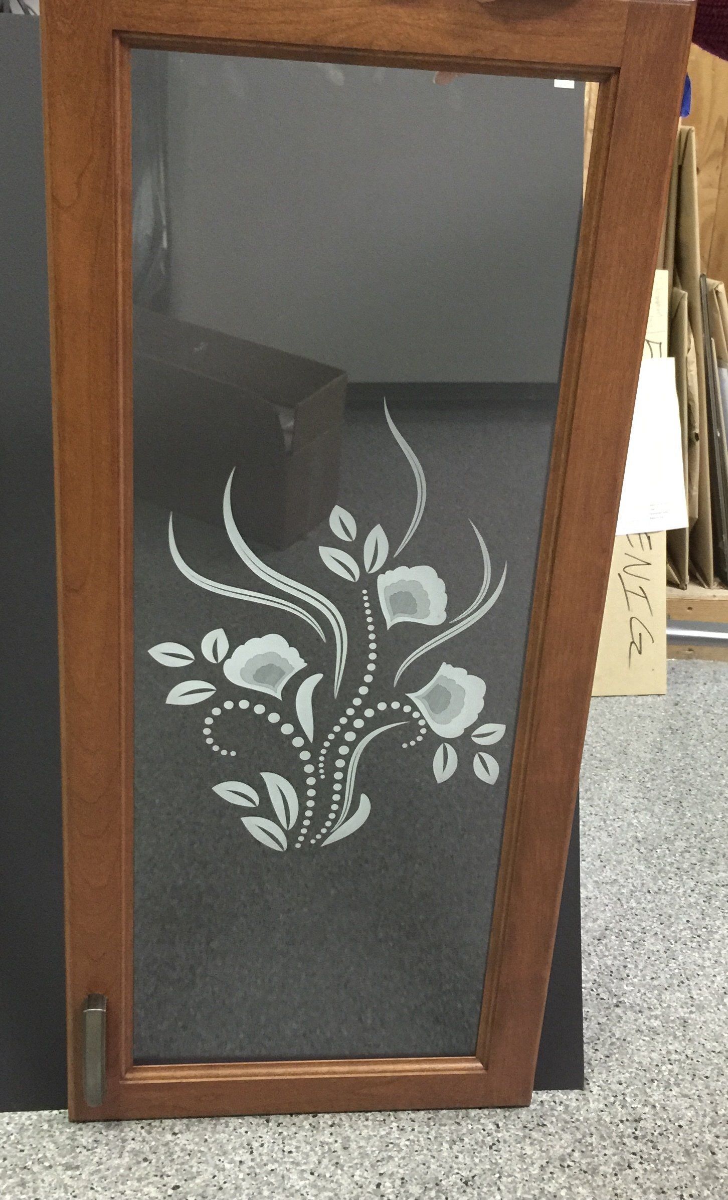 A wooden frame with a floral design on it