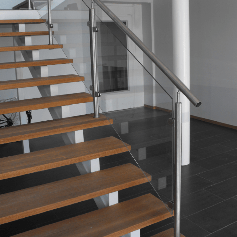 A staircase with wooden steps and a glass railing