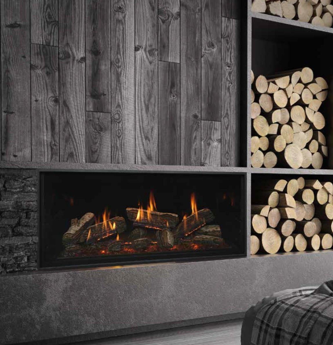 Fireplace with lit flames, set in a stone wall. A marble shelf supports art and decor; a living room setting.