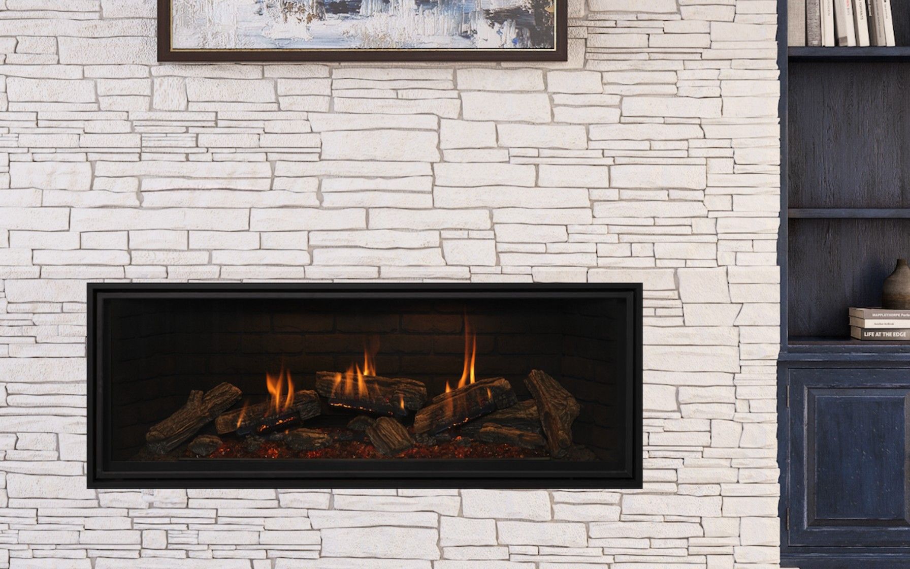 Fireplace with a stone facade, flanked by wooden shelving and a cabinet. Above the fireplace is a mounted deer head.