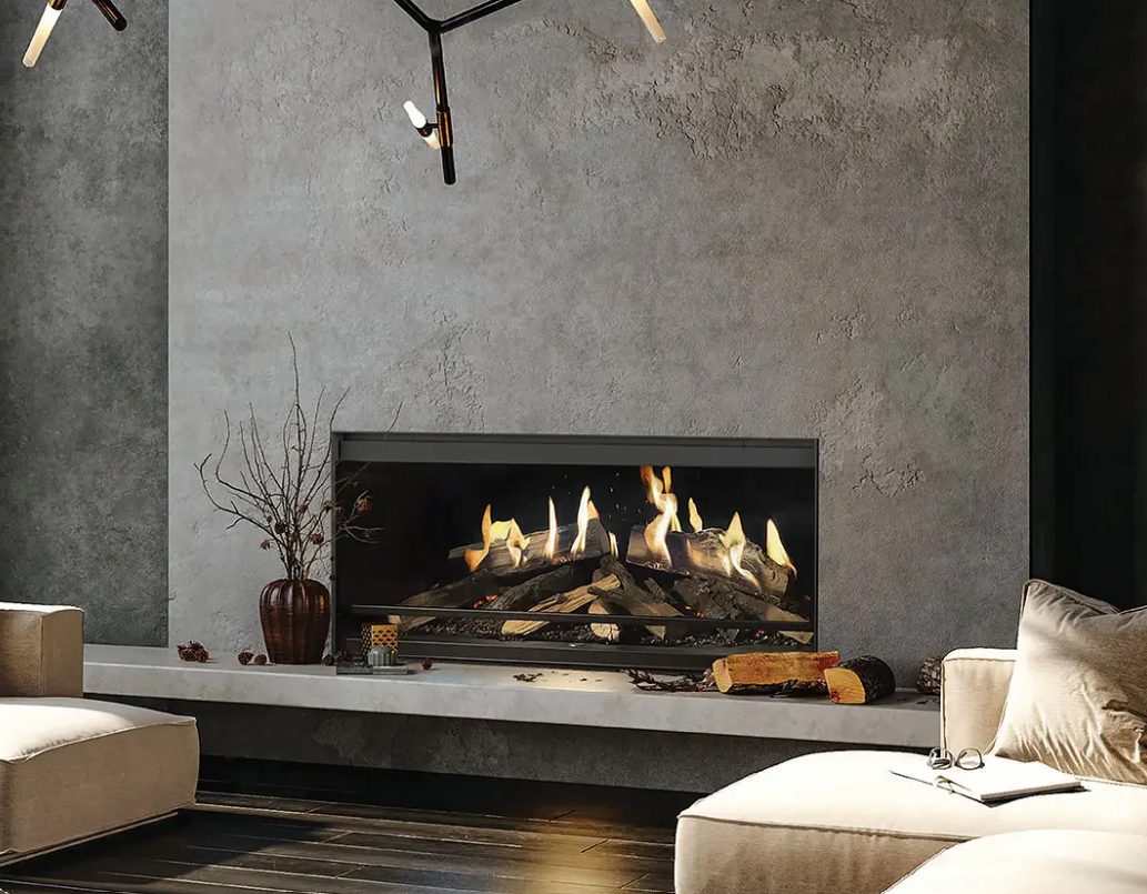 Modern electric fireplace with faux logs and flames set within a marble and white tiled wall.