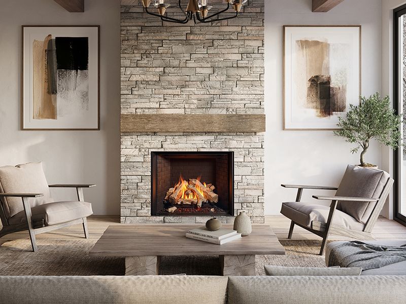 A modern fireplace with blue tile surround, white mantel, and a roaring fire. Living room setting with contemporary furniture.