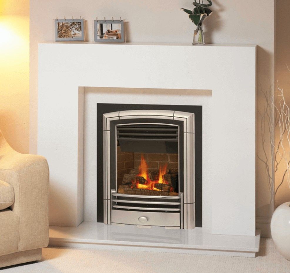 A gas fireplace with burning logs and flames, set in a black-framed opening.