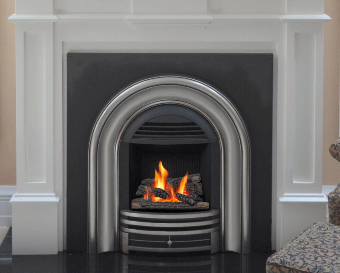 A black gas fireplace with burning logs and flames.