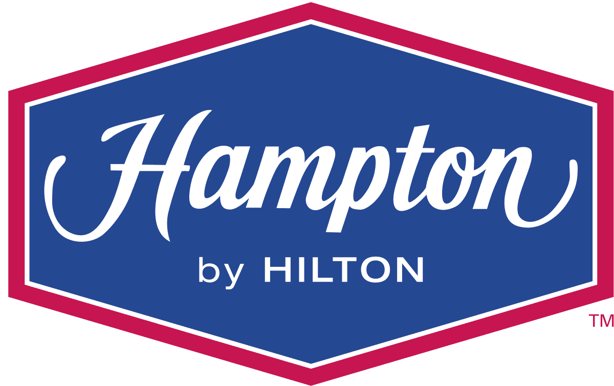 The logo for hampton by hilton is blue and pink.