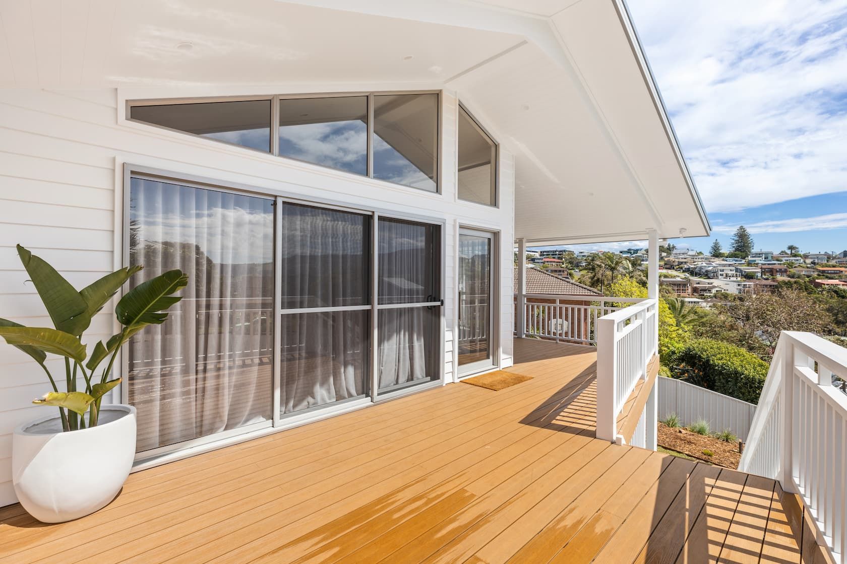 A White House With A Wooden Porch — Ridgeline Building Co In Gerringong, NSW