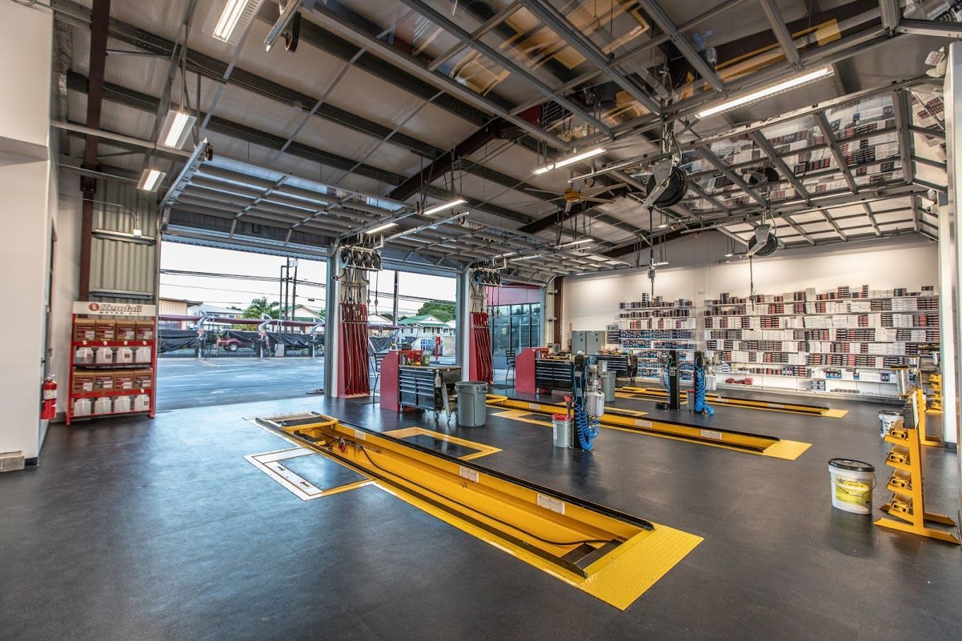 A large garage with a lot of tools and equipment in it.