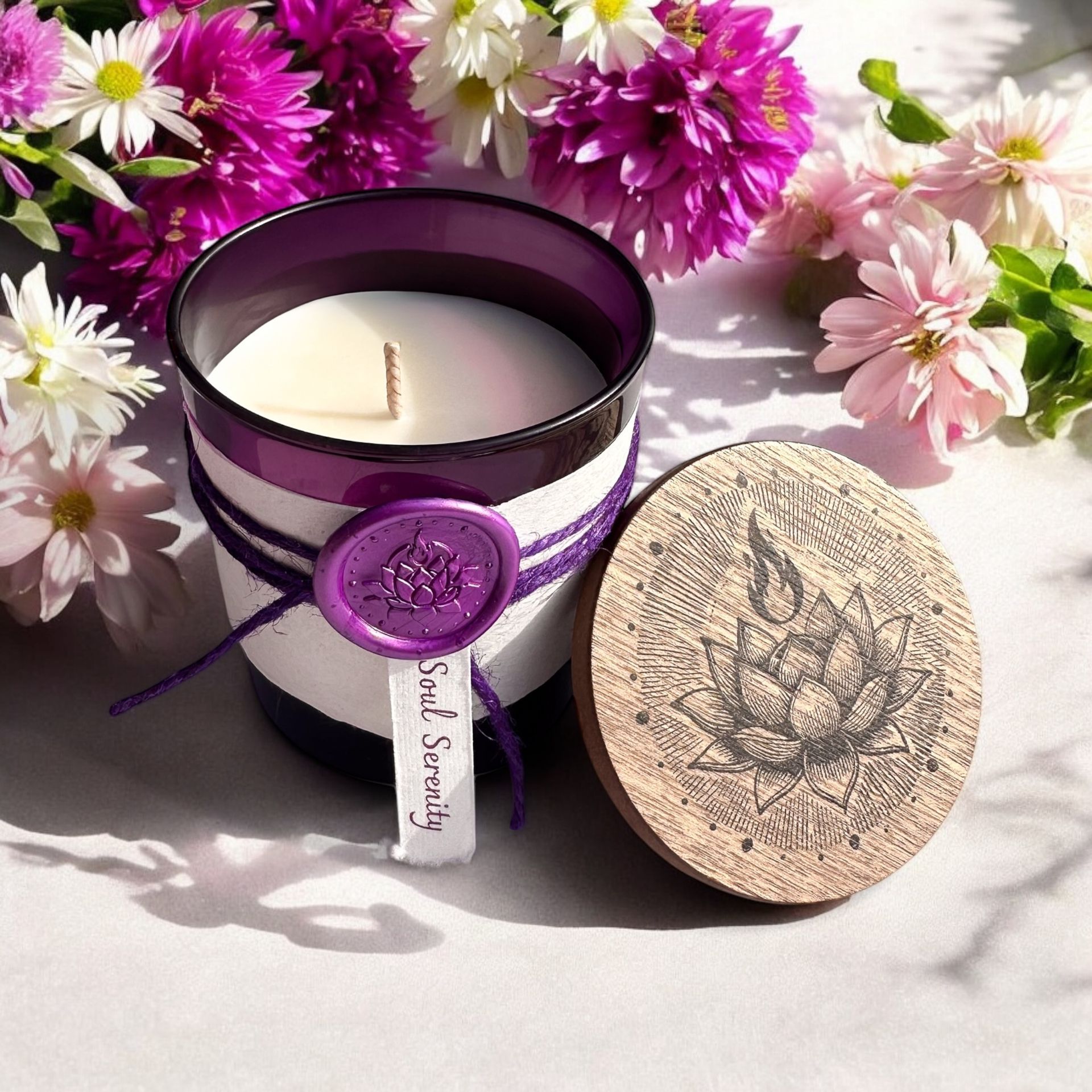 Open Soul Serenity candle by Eldara, surrounded by spring flowers. Infused with amethyst and sacred oils to uplift the spirit and invite gentle renewal.