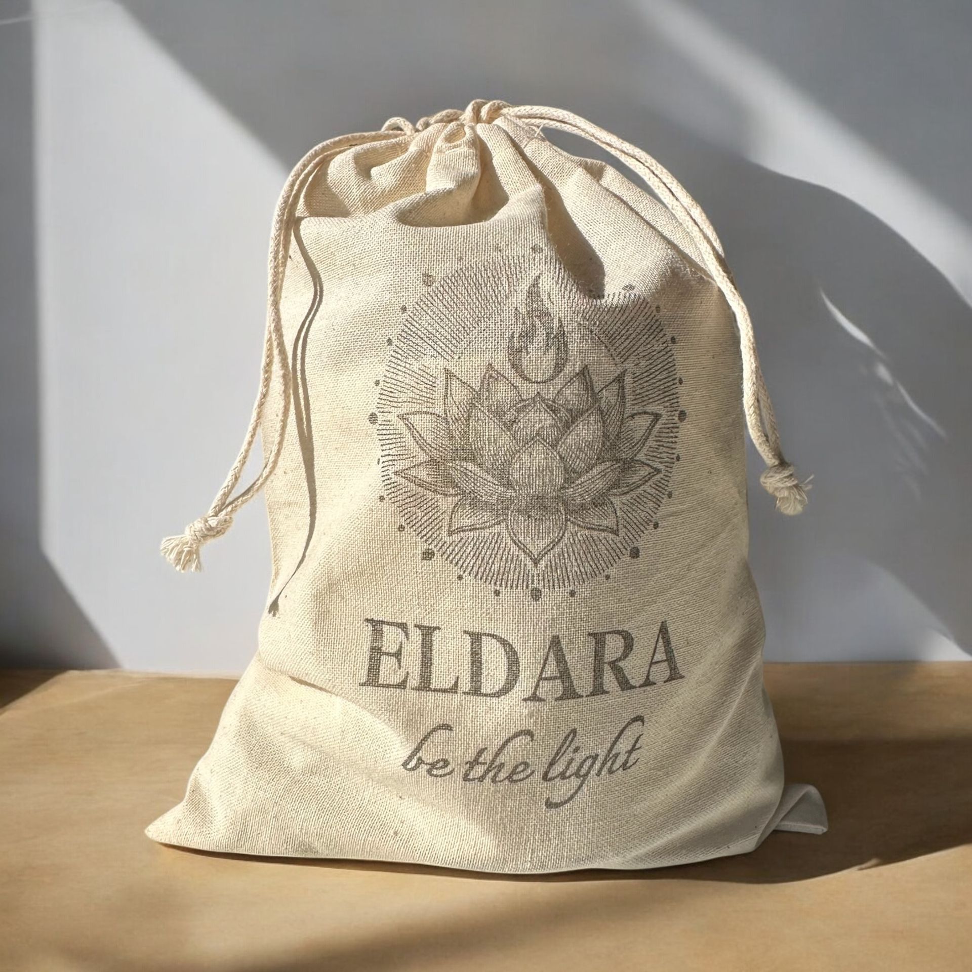 Natural cotton canvas bag printed with the Eldara logo, used to wrap each ritual candle—offering a sacred, intentional and eco-conscious presentation.
