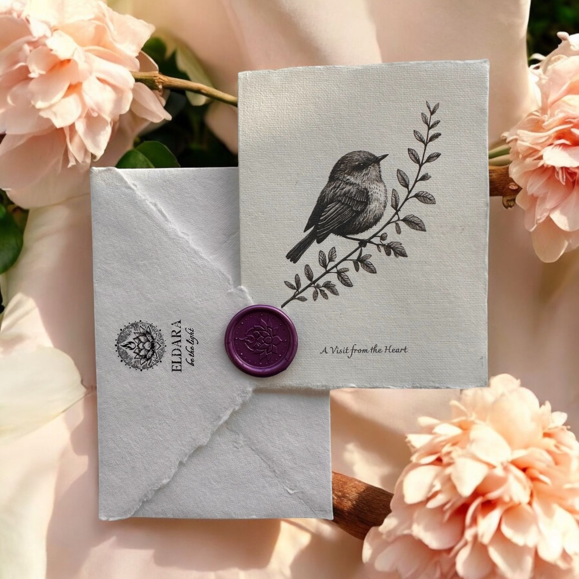 “A Visit from the Heart” greeting card by Eldara, featuring a robin perched on a branch. A comforting message of connection, remembrance and spiritual presence.