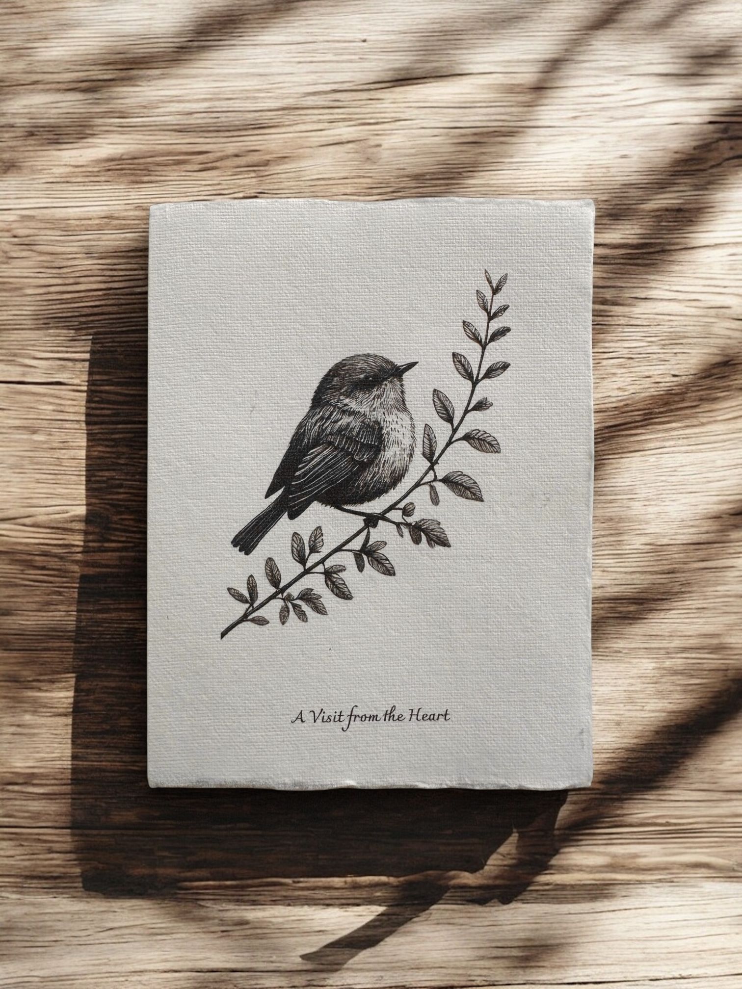 “A Visit from the Heart” greeting card by Eldara, featuring a robin perched on a branch. A message of connection, remembrance, and spiritual presence, printed on handmade cotton rag paper.