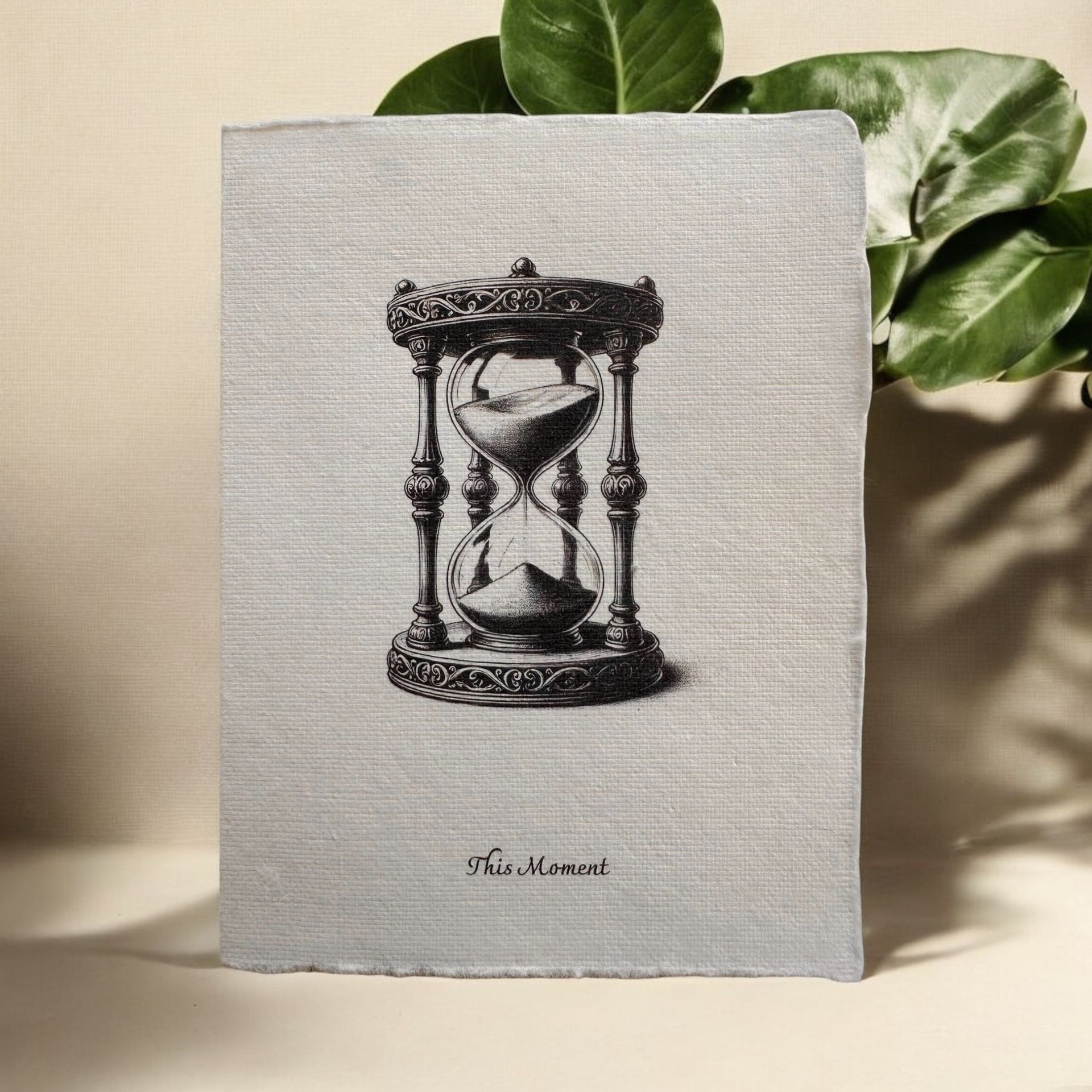 “This Moment” greeting card by Eldara, featuring an hourglass illustration and mindful message—printed on handmade cotton rag paper to inspire presence and reflection.

