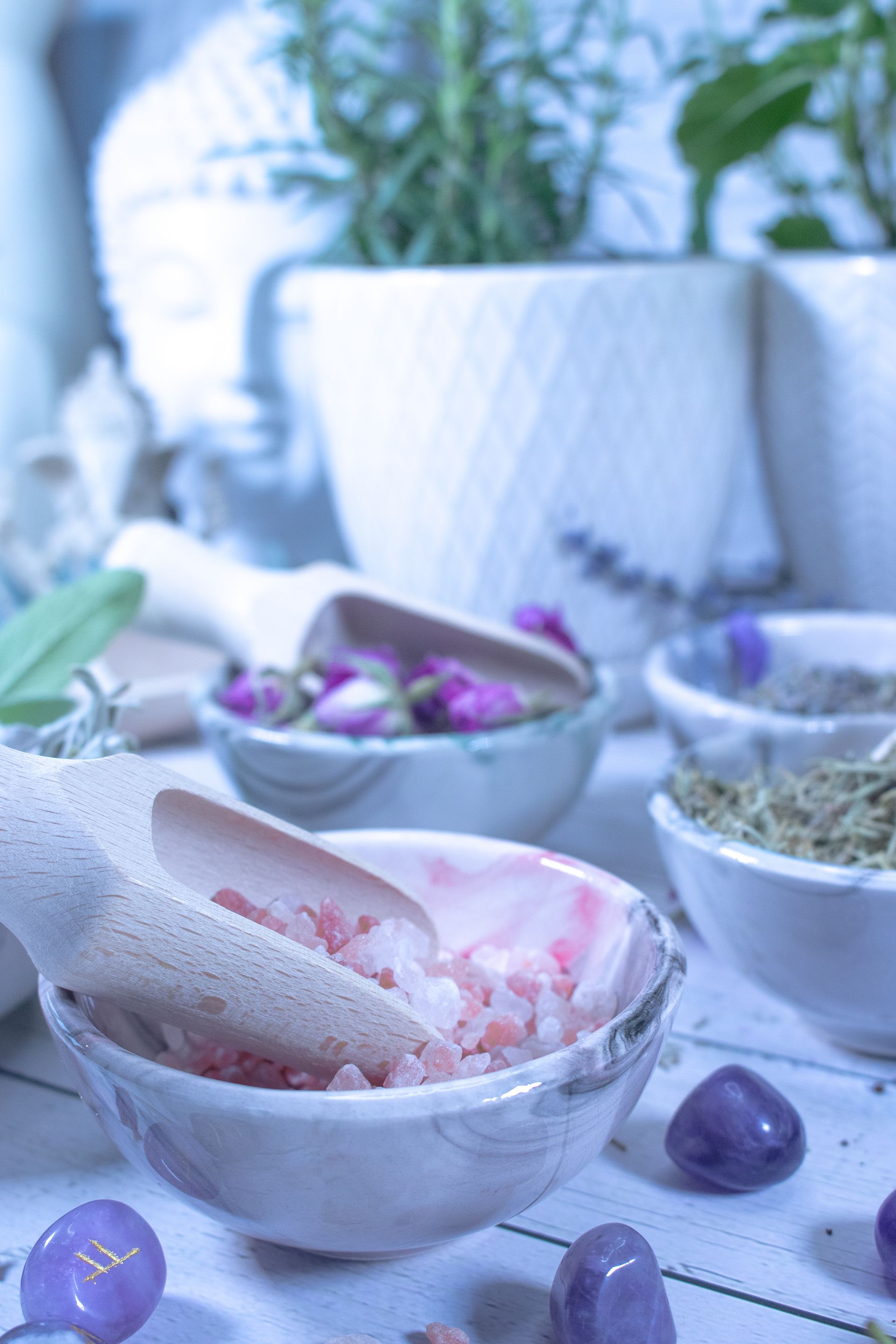 Eldara studio background with bowls of herbs, a pestle and mortar—used in sacred preparation rituals for candle making and spiritual creation.