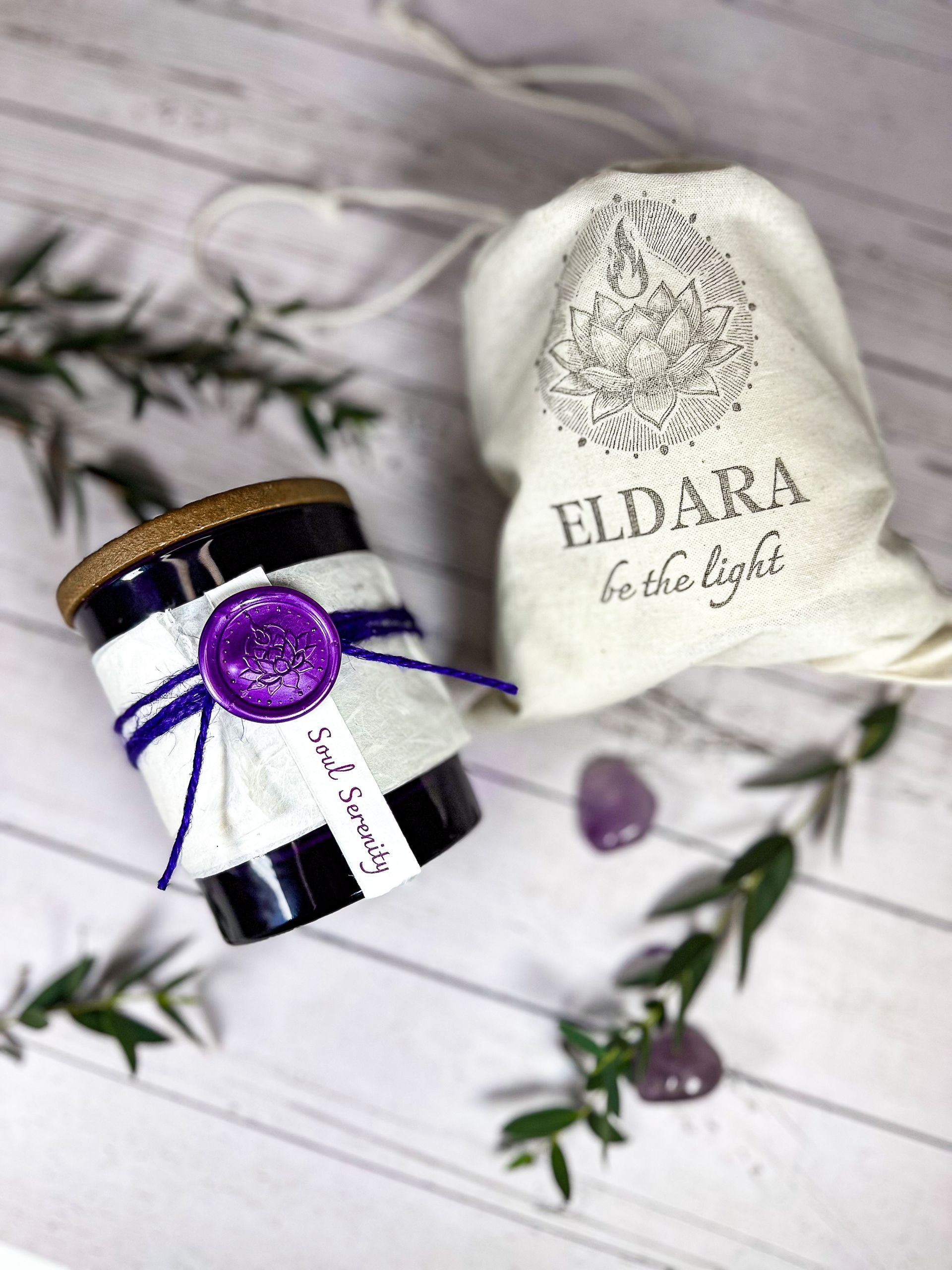 Closed Soul Serenity candle by Eldara, shown with its cotton canvas bag. Infused with amethyst and sacred oils to support peace, clarity and spiritual grounding.