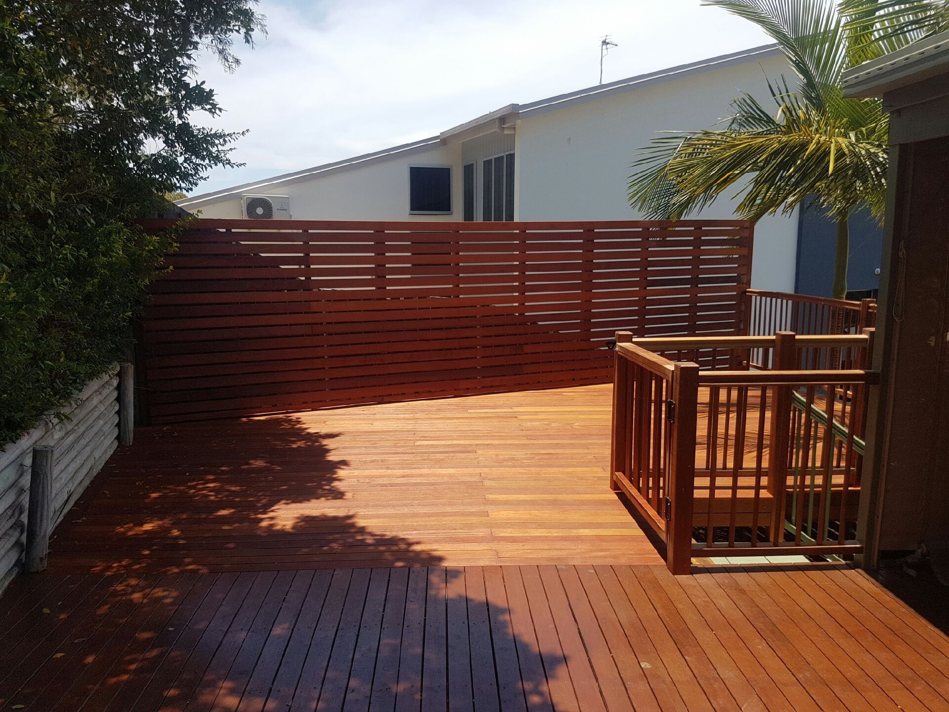 Two Men Are Working on a Wall in a Room — Bob Ryan's Home Improvements & Construction Pty Ltd in Beecher, QLD