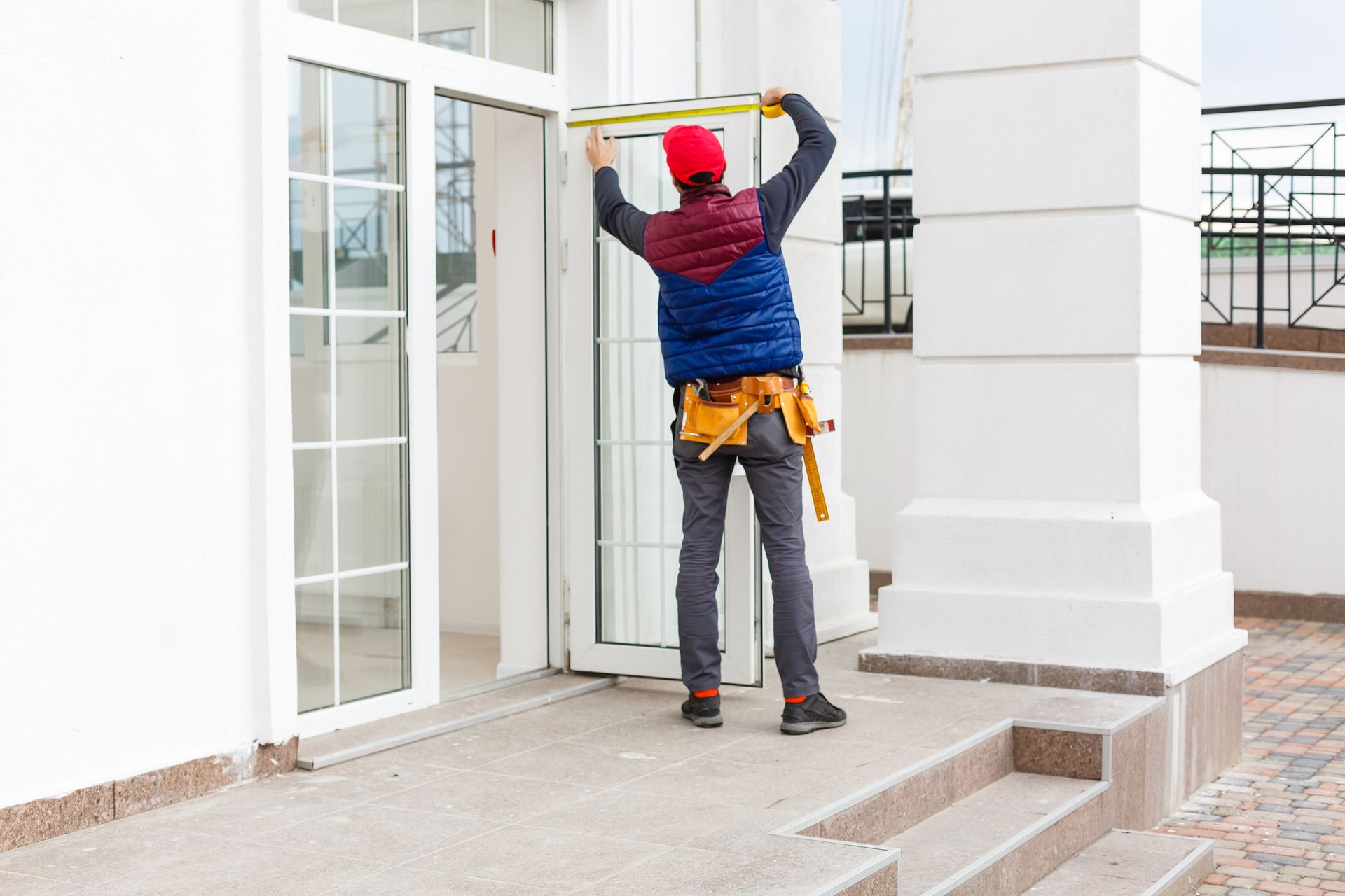 Builder mounting a glass exterior door