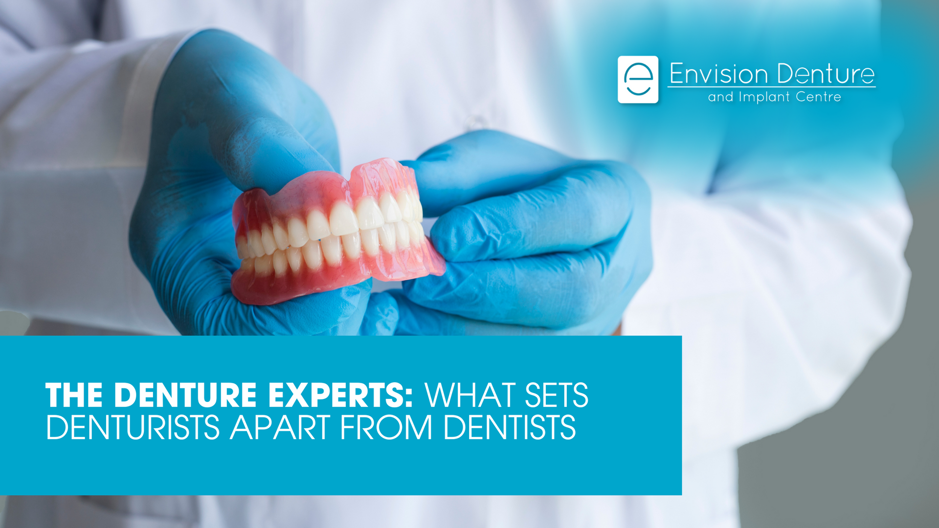 A dentist is holding a denture in his hands.