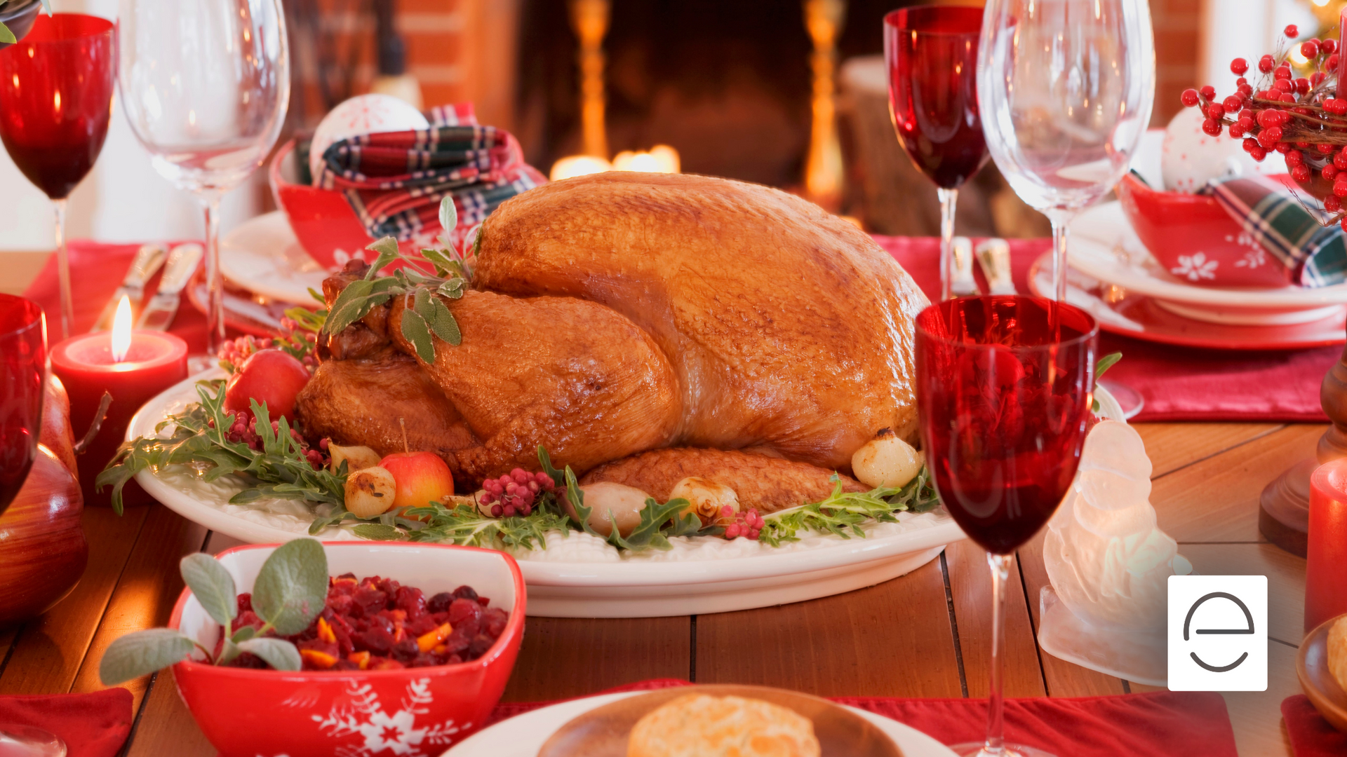 A roasted turkey is on a plate on a christmas table.