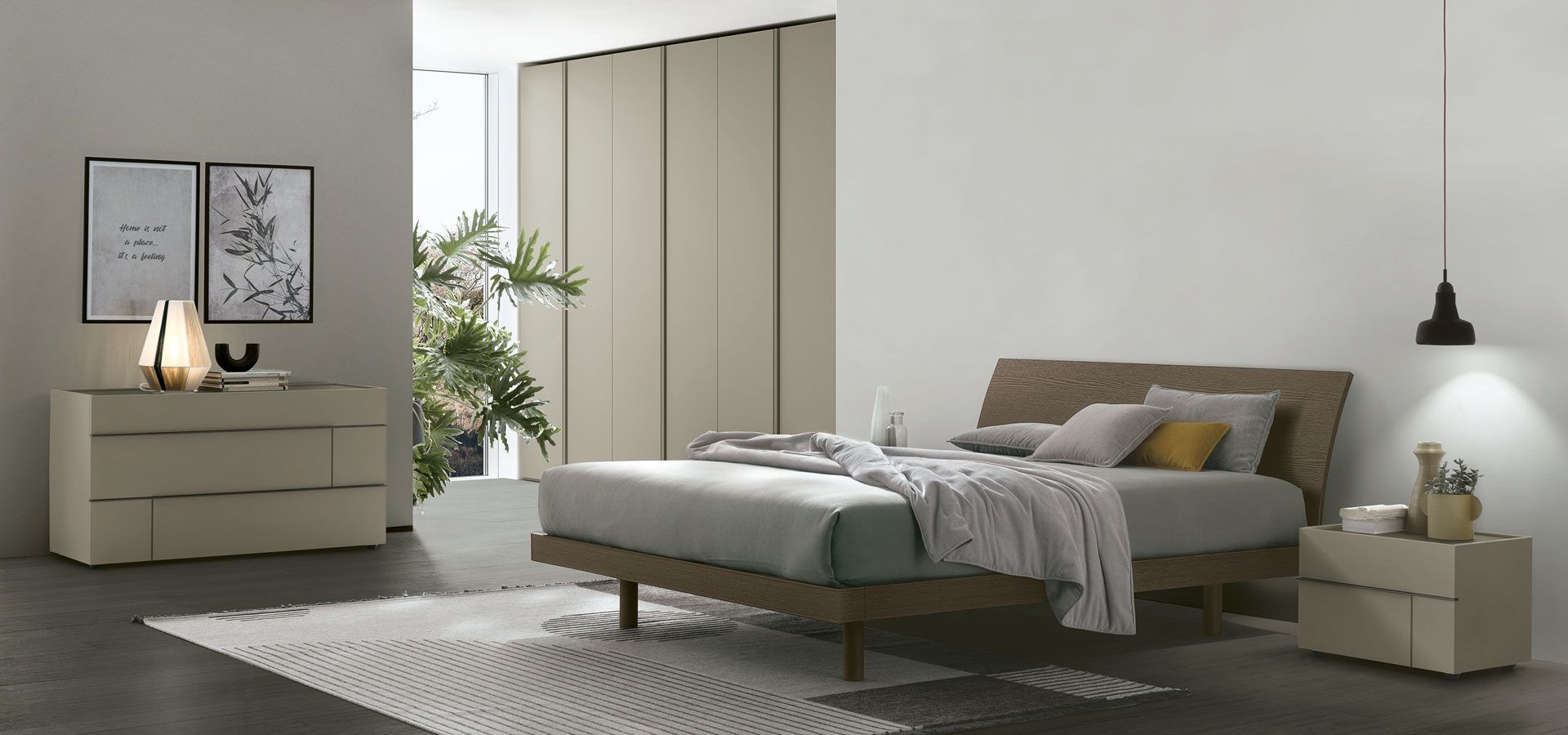 Una camera da letto con un letto, una cassettiera e un comodino