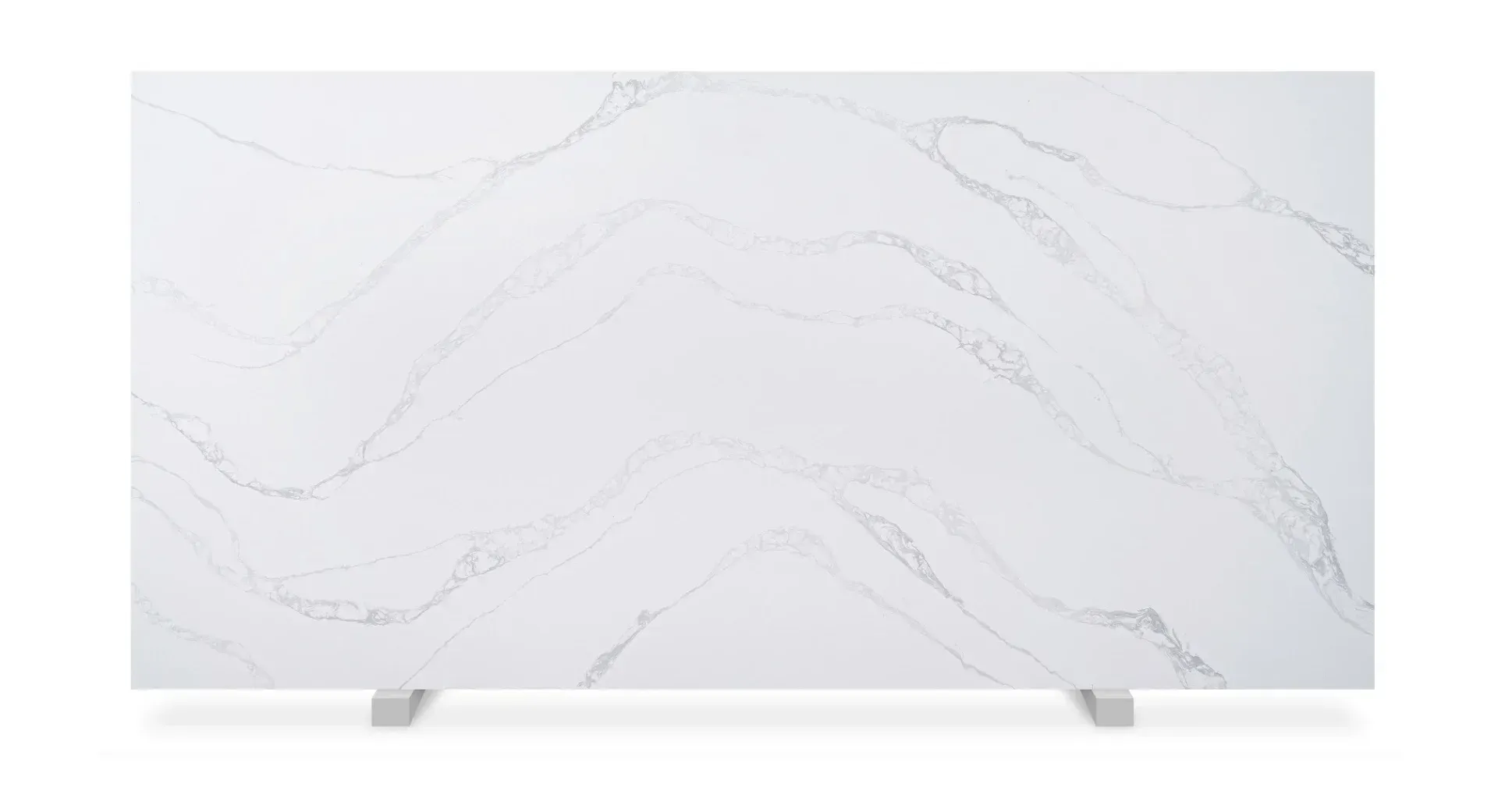 White quartz countertop with gray veining, resting on metal supports.