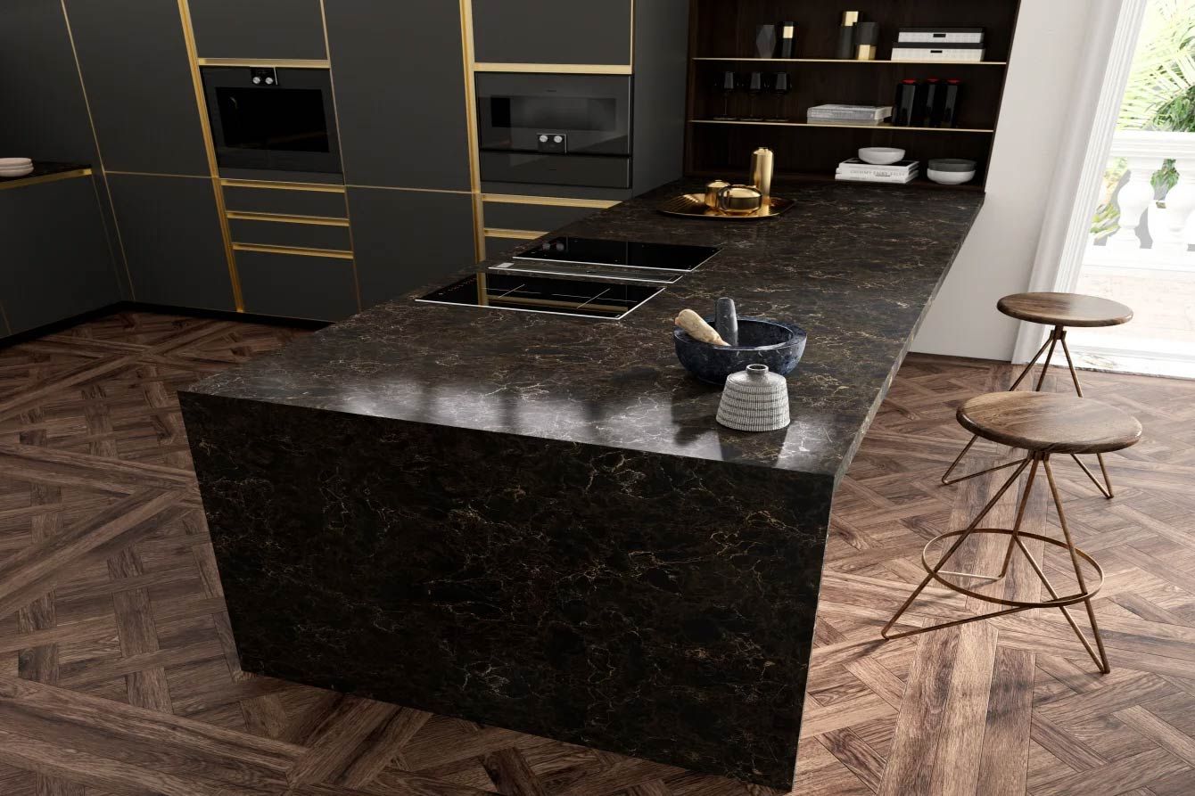 Dark kitchen island with cooktop, stools, dark cabinetry, and a patterned floor.