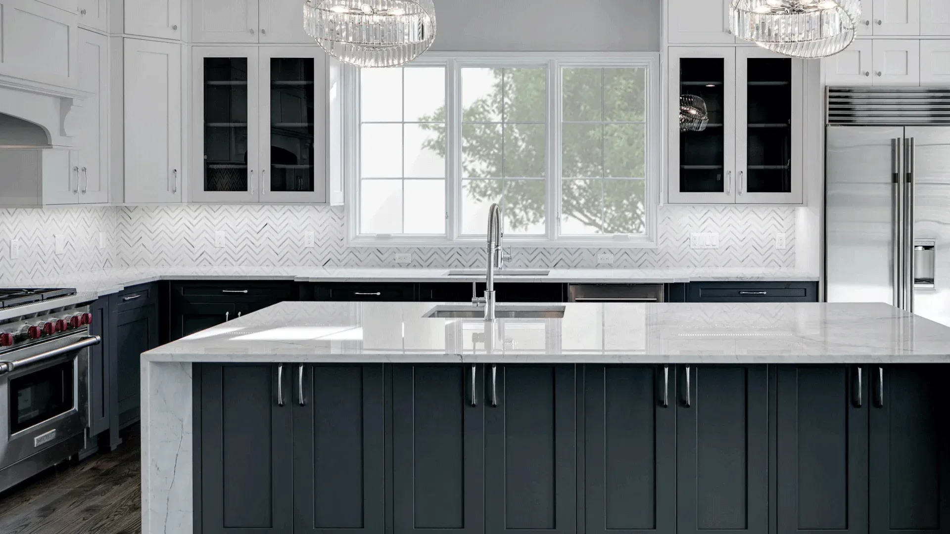 Modern kitchen with white countertops, dark blue cabinets, and a large island with a sink.