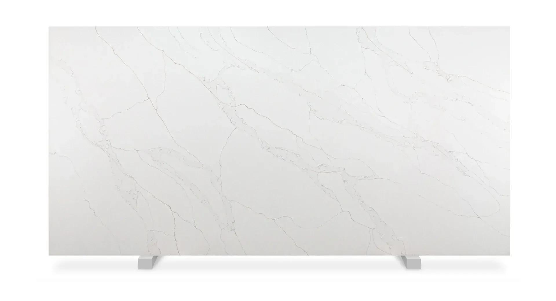 White quartz countertop slab with subtle veining, displayed on support legs.