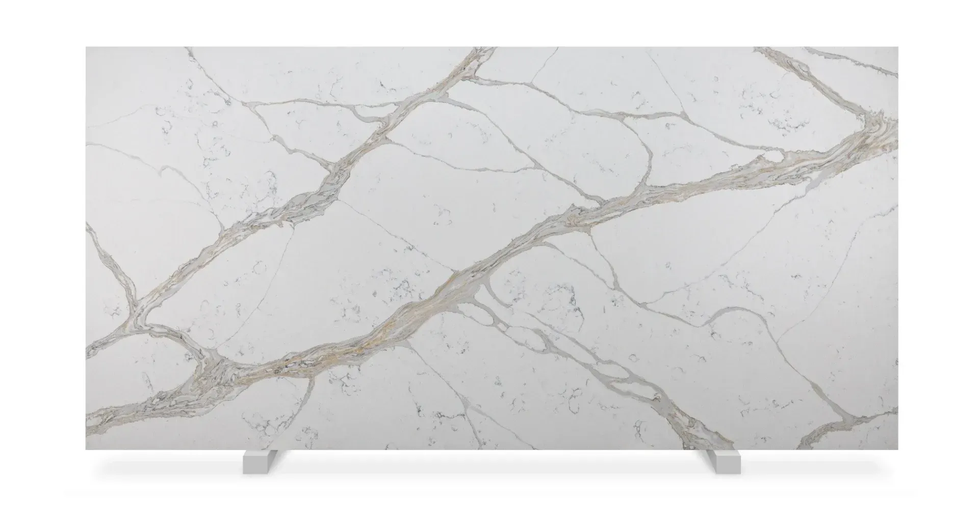 White quartz slab with gold veining, displayed on a white stand.