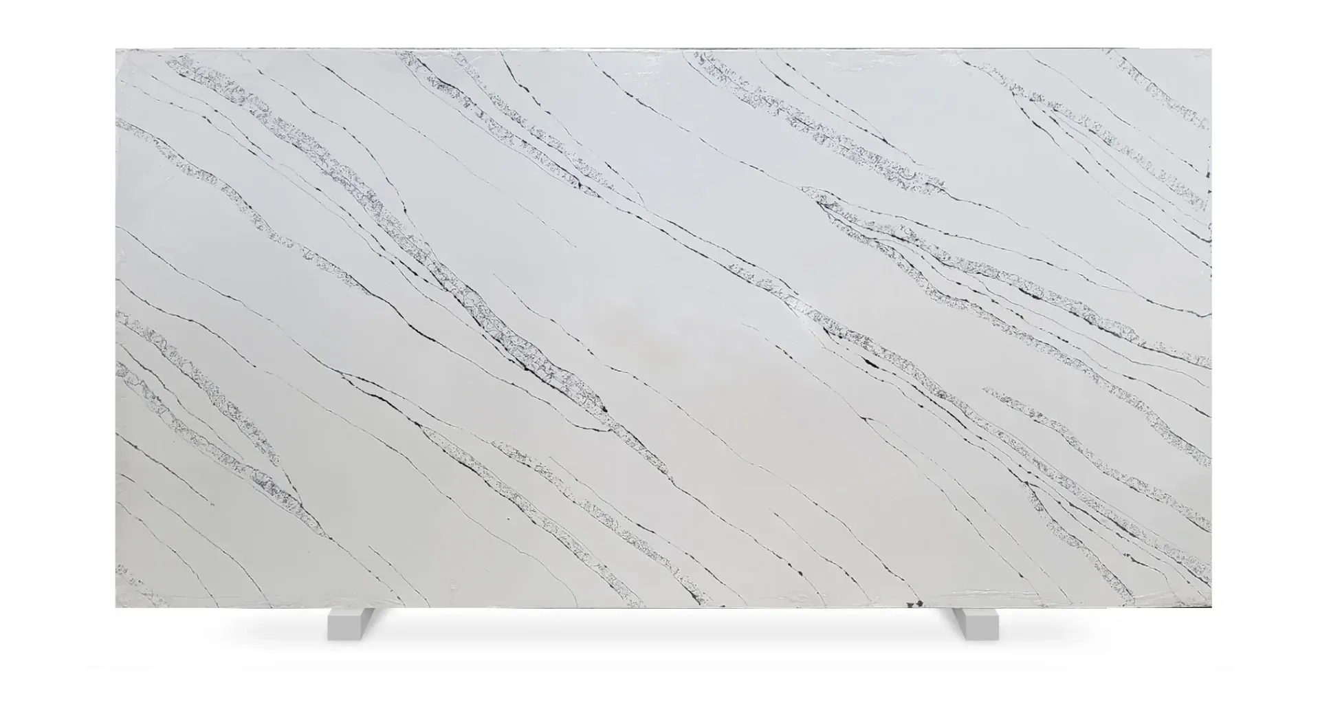 White countertop with diagonal black veining and small black speckles.