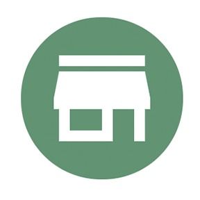 White storefront icon in a green circle.