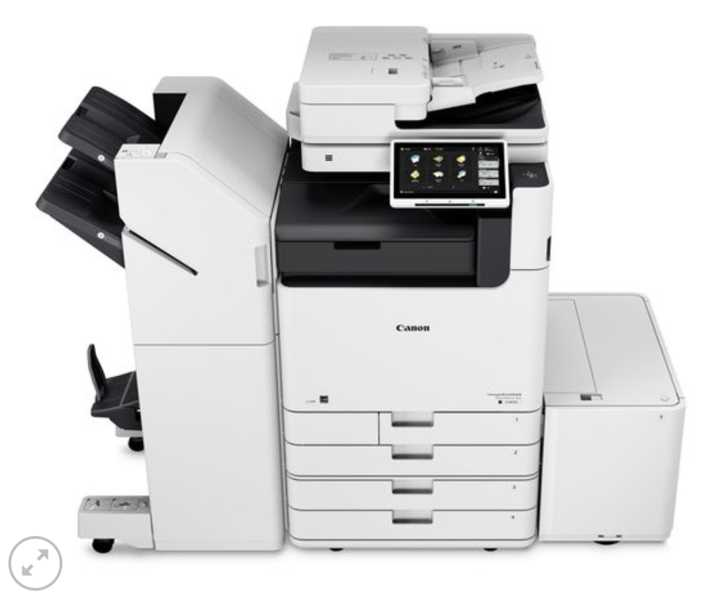 A canon printer is sitting on a white surface
