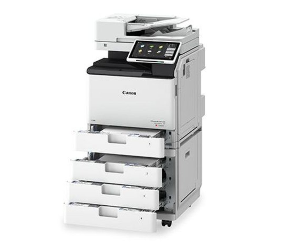 A canon printer is sitting on a white surface