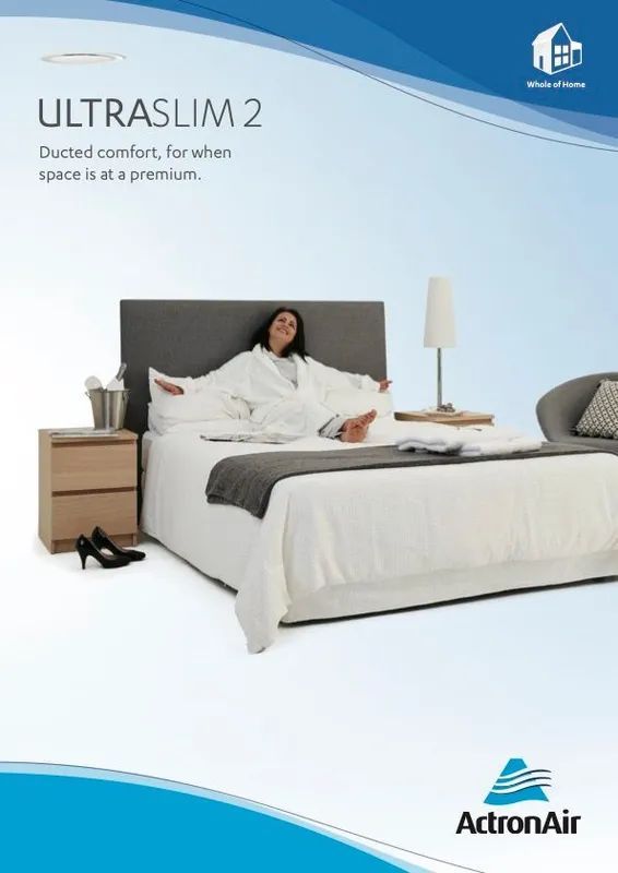 A Woman Is Laying On A Bed With A Laptop On Her Lap — Marty Nelson Refrigeration & Air Conditioning In Dubbo, NSW