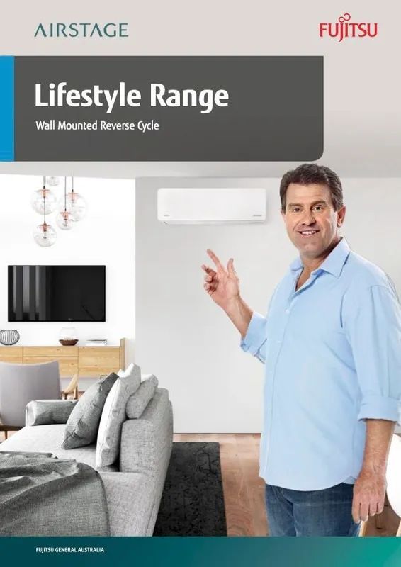 A Man Is Pointing At A Wall Mounted Air Conditioner — Marty Nelson Refrigeration & Air Conditioning In Dubbo, NSW