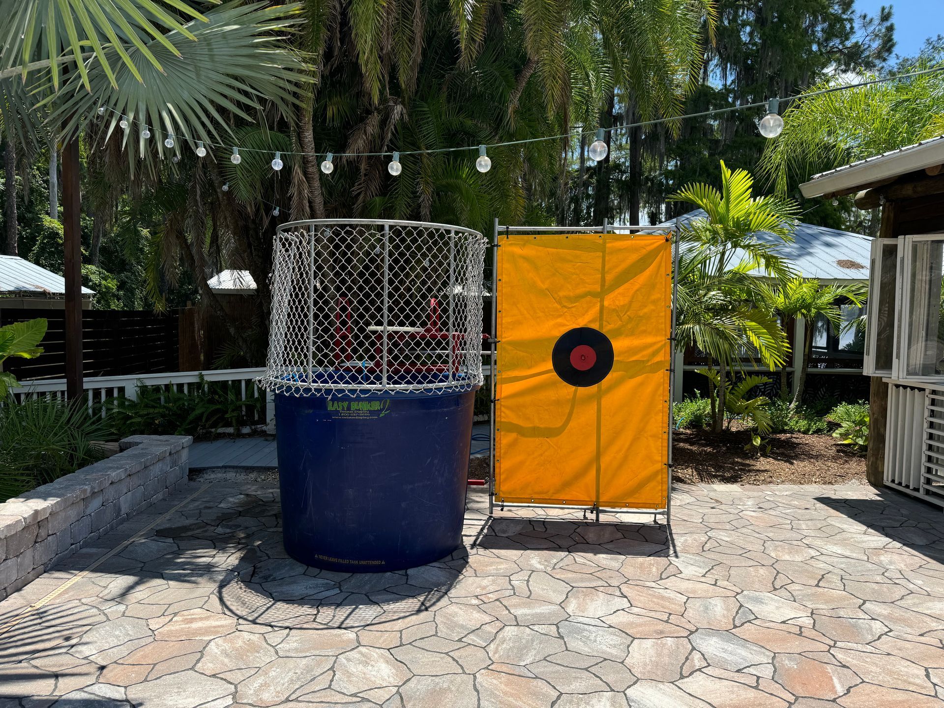 Dunk tank setup outdoors in the sun ready to be used