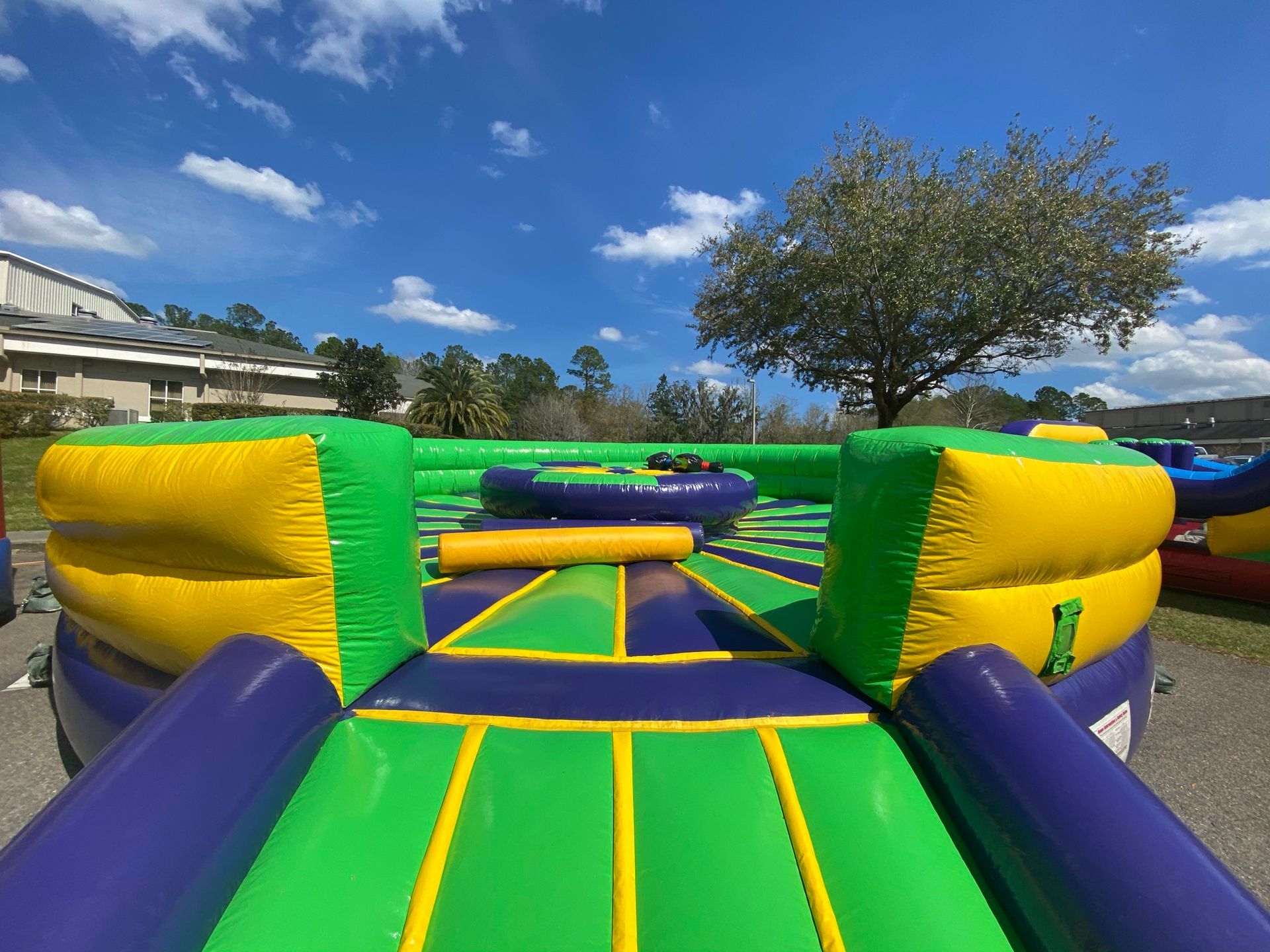  Inflatable jousting arena with pedestals for dueling players.