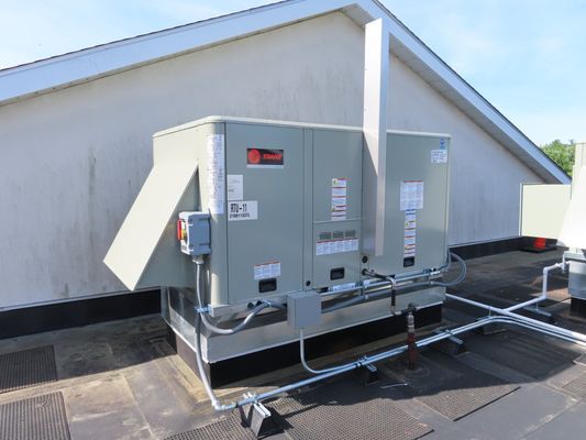 Industrial Trane HVAC unit installed on a rooftop curb.