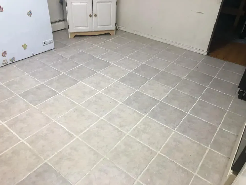 A man and a woman are making a heart shape with their hands in a car.