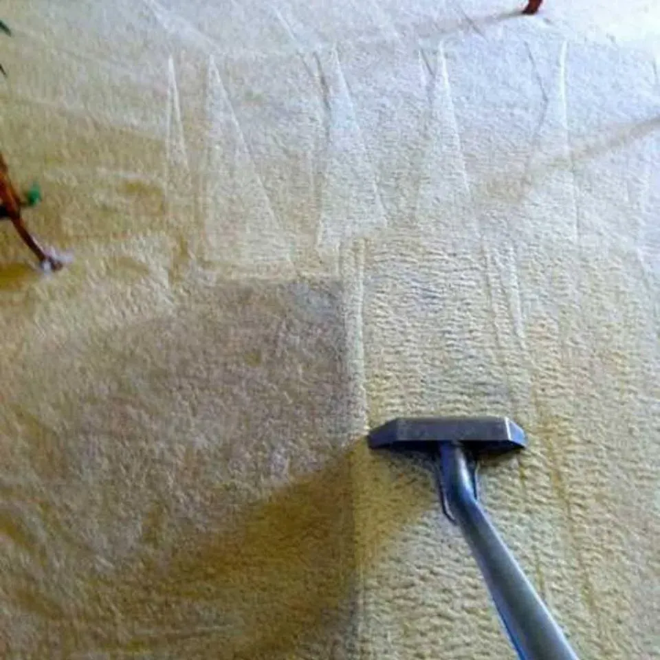 A swimming pool surrounded by palm trees and chairs at sunset.