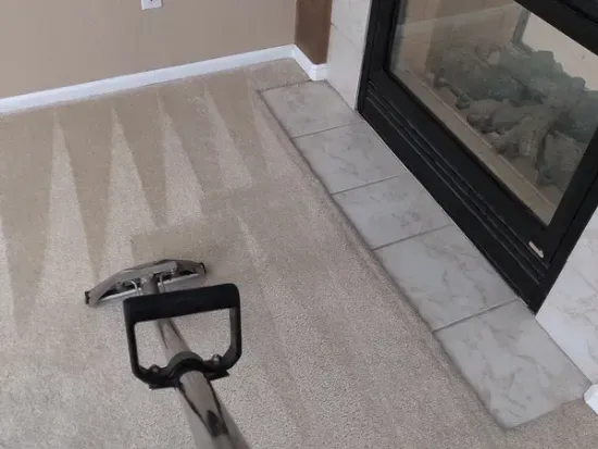 Three women are sitting on the back of a boat in the water.