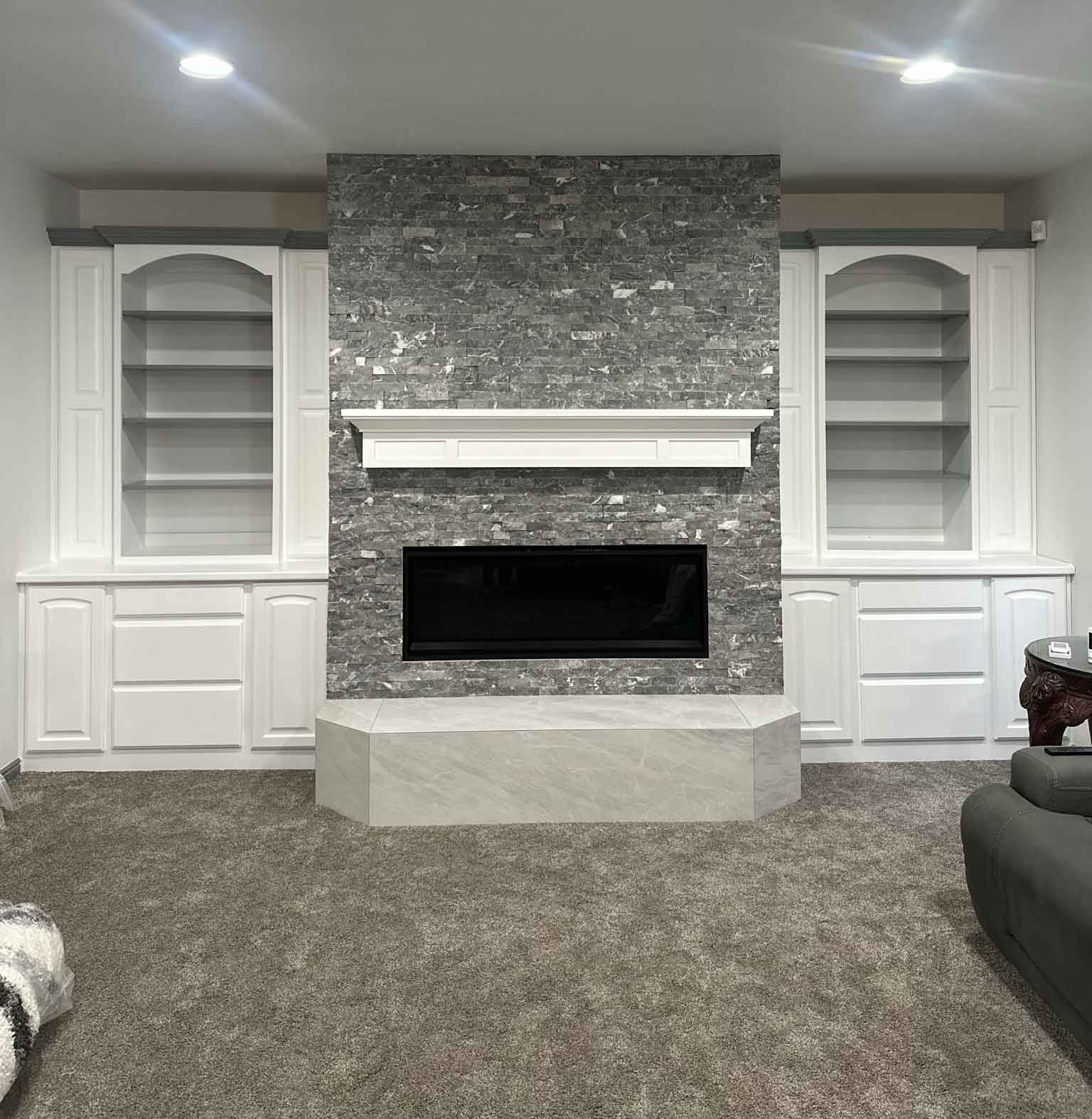 There is a fireplace in the middle of the room.