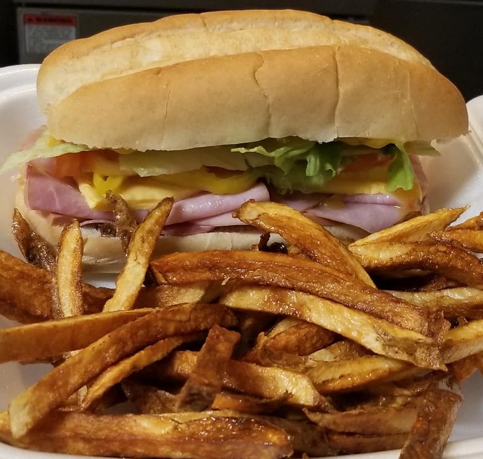 Quesadillas with salsa and sour cream in a red basket on a table.