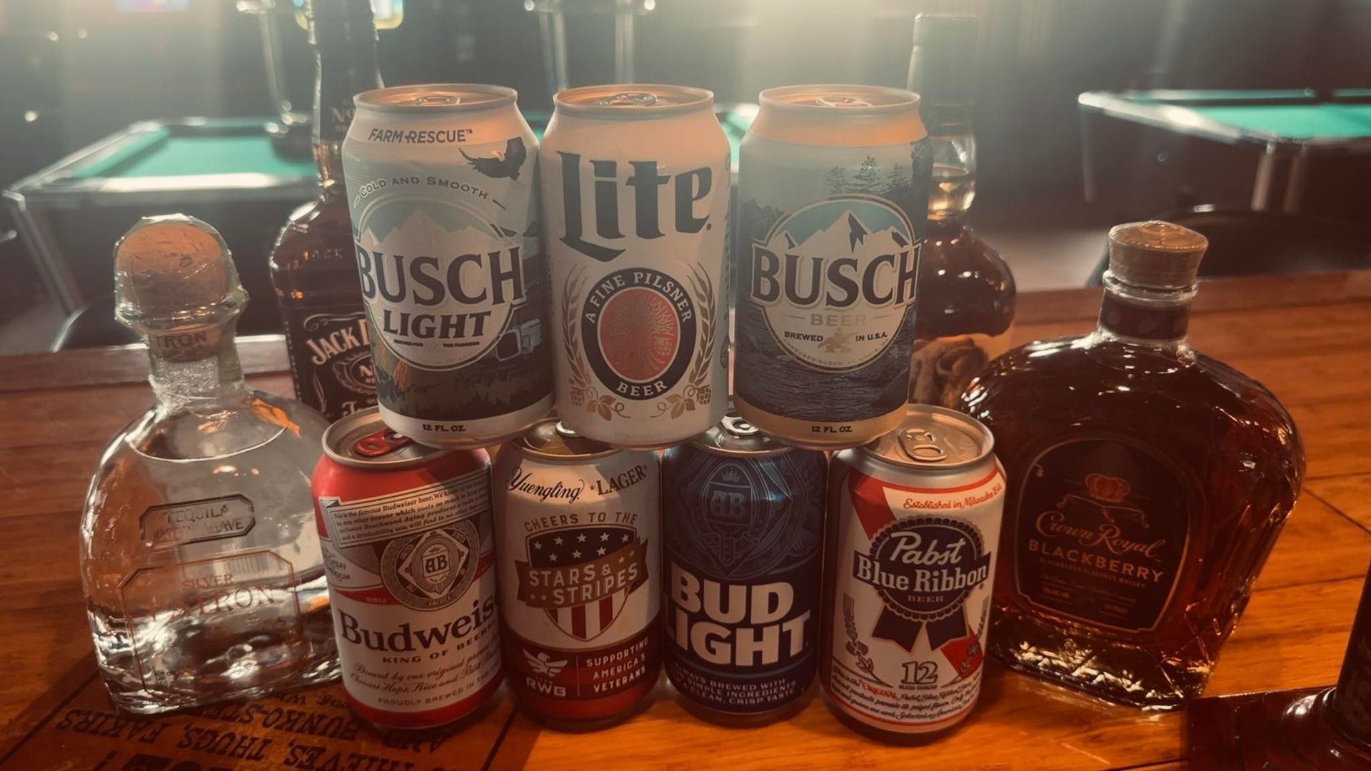 Fried chicken wings in a red basket, lined with paper; a glass of soda is visible.