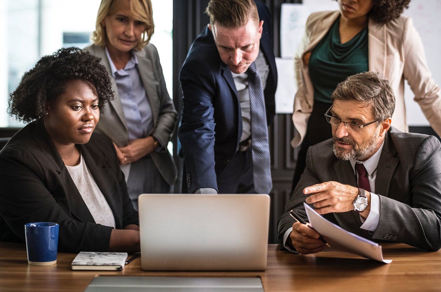 Business People Looking on a Laptop