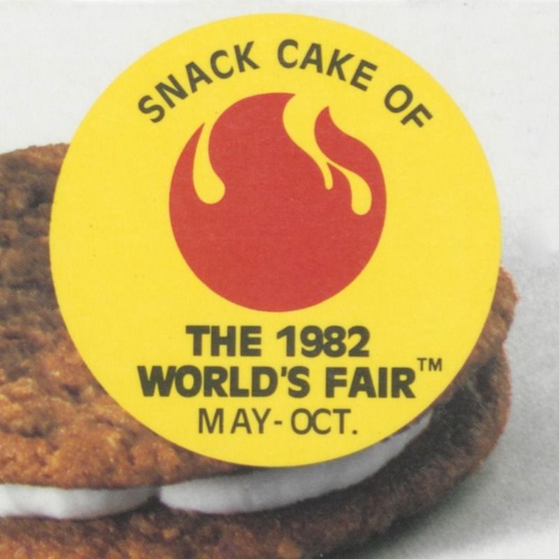 A yellow sticker that says snack cake of the 1982 world 's fair